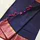 handloom pure cotton saree in deep ink blue with contrasting magenta pink striped zari border and handcrafted tassels on pallu 