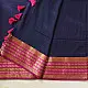 handloom pure cotton saree in deep ink blue with contrasting magenta pink striped zari border and handcrafted tassels on pallu 