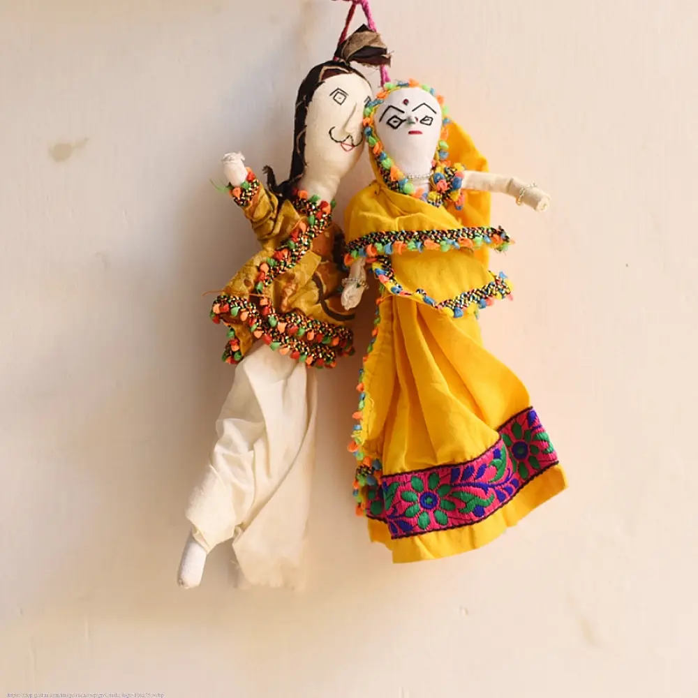 handcrafted traditional kutchi couple cloth dolls in yellow and white ethnic outfits with mirror work embroidery
