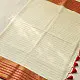 handloom pure cotton saree in soft ivory white featuring a contrasting rust orange striped zari border and handcrafted tassels on pallu