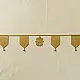 handmade brass toran door hanging featuring geometric brass flags linked on a brass chain with a central floral motif pendant