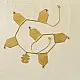handmade brass toran door hanging featuring geometric brass flags linked on a brass chain with a central floral motif pendant