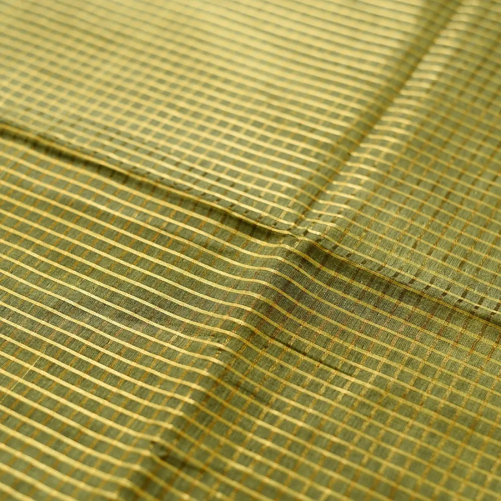handloom pure cotton saree in subtle olive heena green with woven golden zari striped border and matching handcrafted tassels on pallu