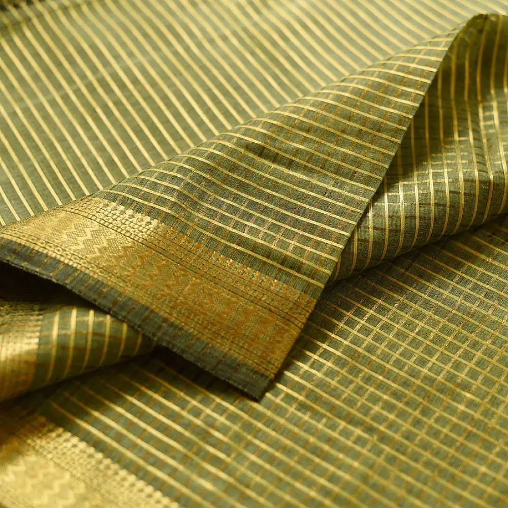 handloom pure cotton saree in subtle olive heena green with woven golden zari striped border and matching handcrafted tassels on pallu