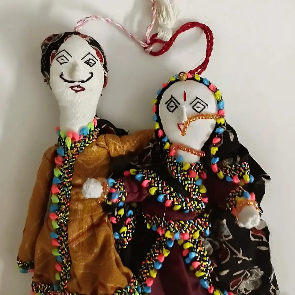 handcrafted kutchi cotton dhingli dolls featuring traditional colorful mirror work outfits
