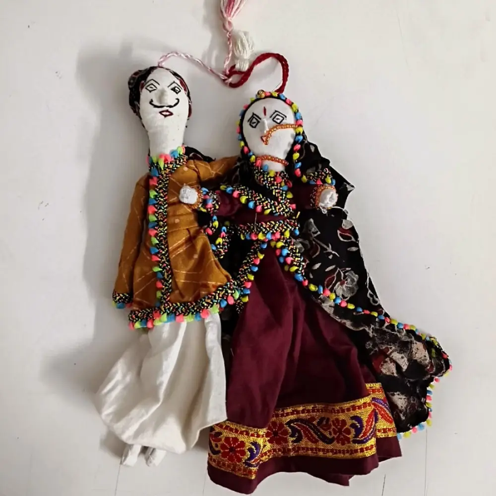 handcrafted kutchi cotton dhingli dolls featuring traditional colorful mirror work outfits