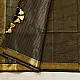 handloom pure cotton saree in classic black featuring fine golden zari checked pattern throughout the body with a rich gold zari border and handcrafted tassels