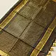 handloom pure cotton saree in classic black featuring fine golden zari checked pattern throughout the body with a rich gold zari border and handcrafted tassels
