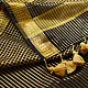 handloom pure cotton saree in classic black featuring fine golden zari checked pattern throughout the body with a rich gold zari border and handcrafted tassels
