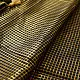 handloom pure cotton saree in classic black featuring fine golden zari checked pattern throughout the body with a rich gold zari border and handcrafted tassels
