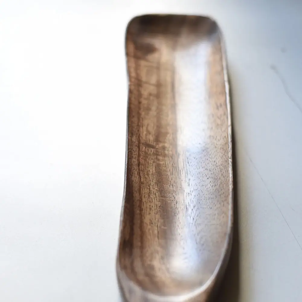 handmade wooden momo platter with long paddle shaped design