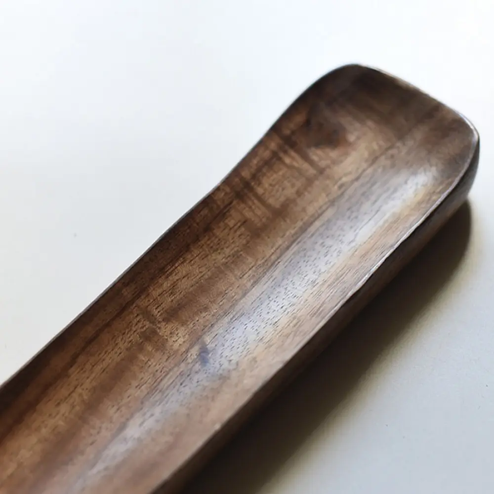 handmade wooden momo platter with long paddle shaped design