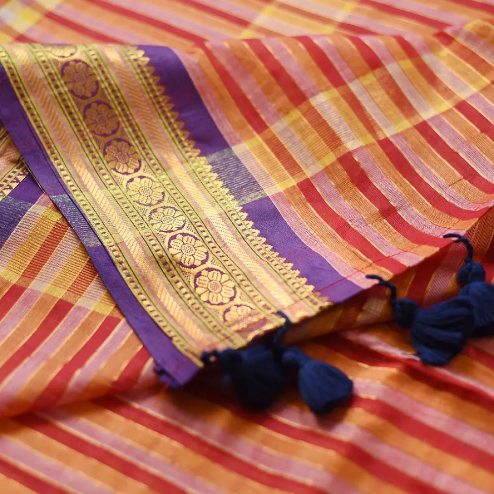 handloom pure cotton saree with vibrant pink orange yellow multicolor stripes contrast purple zari border and handcrafted navy tassels