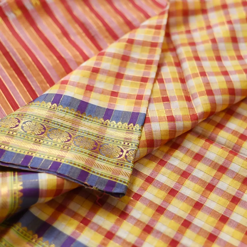 handloom pure cotton saree with vibrant pink orange yellow multicolor stripes contrast purple zari border and handcrafted navy tassels