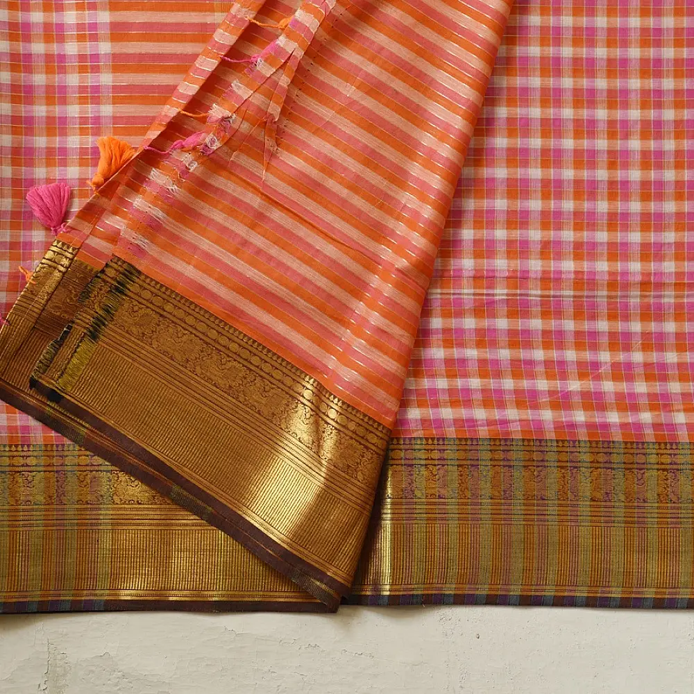 handloom pure cotton saree with peach and orange sunset striped pattern woven gold zari border and handcrafted pink and orange tassels