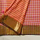 handloom pure cotton saree with peach and orange sunset striped pattern woven gold zari border and handcrafted pink and orange tassels