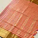 handloom pure cotton saree with peach and orange sunset striped pattern woven gold zari border and handcrafted pink and orange tassels