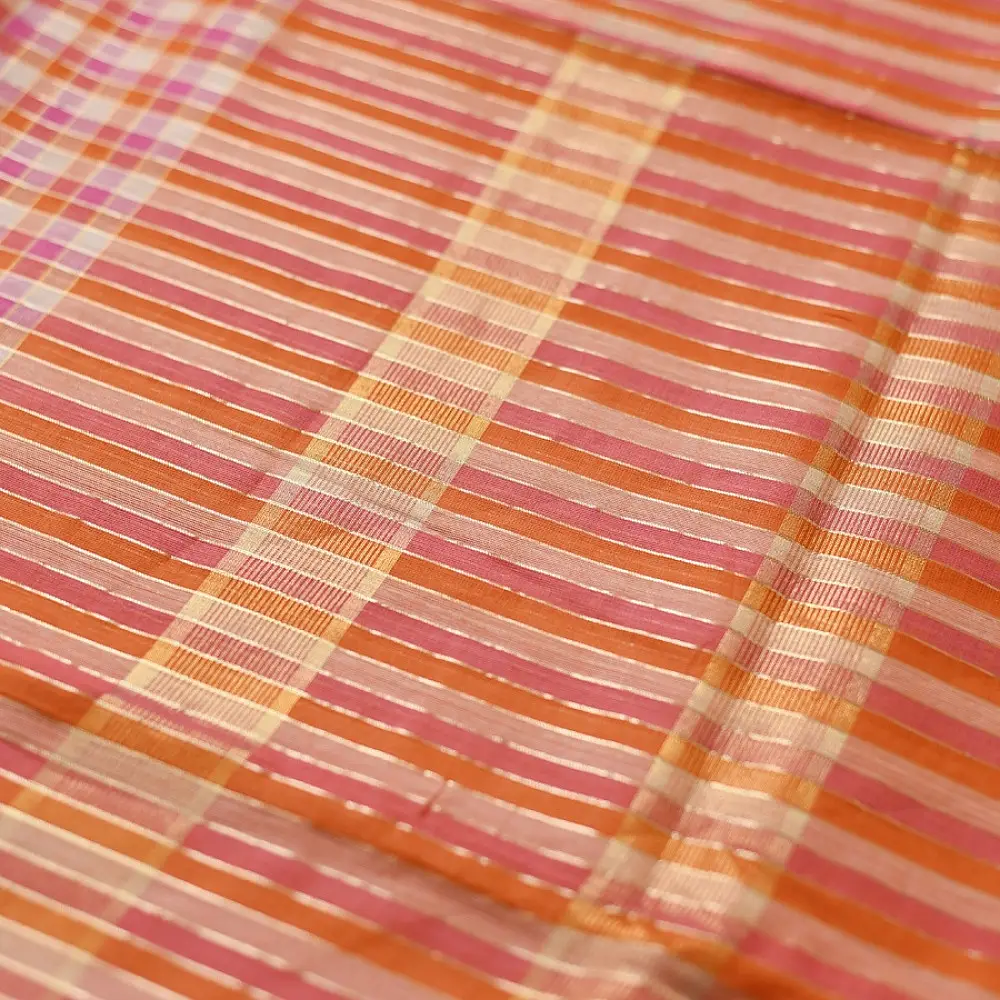 handloom pure cotton saree with peach and orange sunset striped pattern woven gold zari border and handcrafted pink and orange tassels
