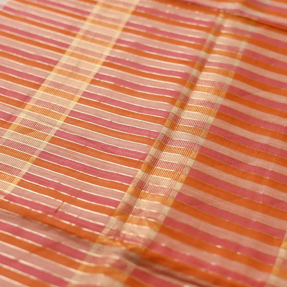 handloom pure cotton saree with peach and orange sunset striped pattern woven gold zari border and handcrafted pink and orange tassels