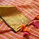 handloom pure cotton saree with peach and orange sunset striped pattern woven gold zari border and handcrafted pink and orange tassels