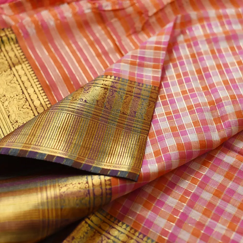handloom pure cotton saree with peach and orange sunset striped pattern woven gold zari border and handcrafted pink and orange tassels