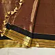 handloom pure cotton saree in deep rust orange with contrasting black border woven with metallic golden zari stripes and handcrafted tassels