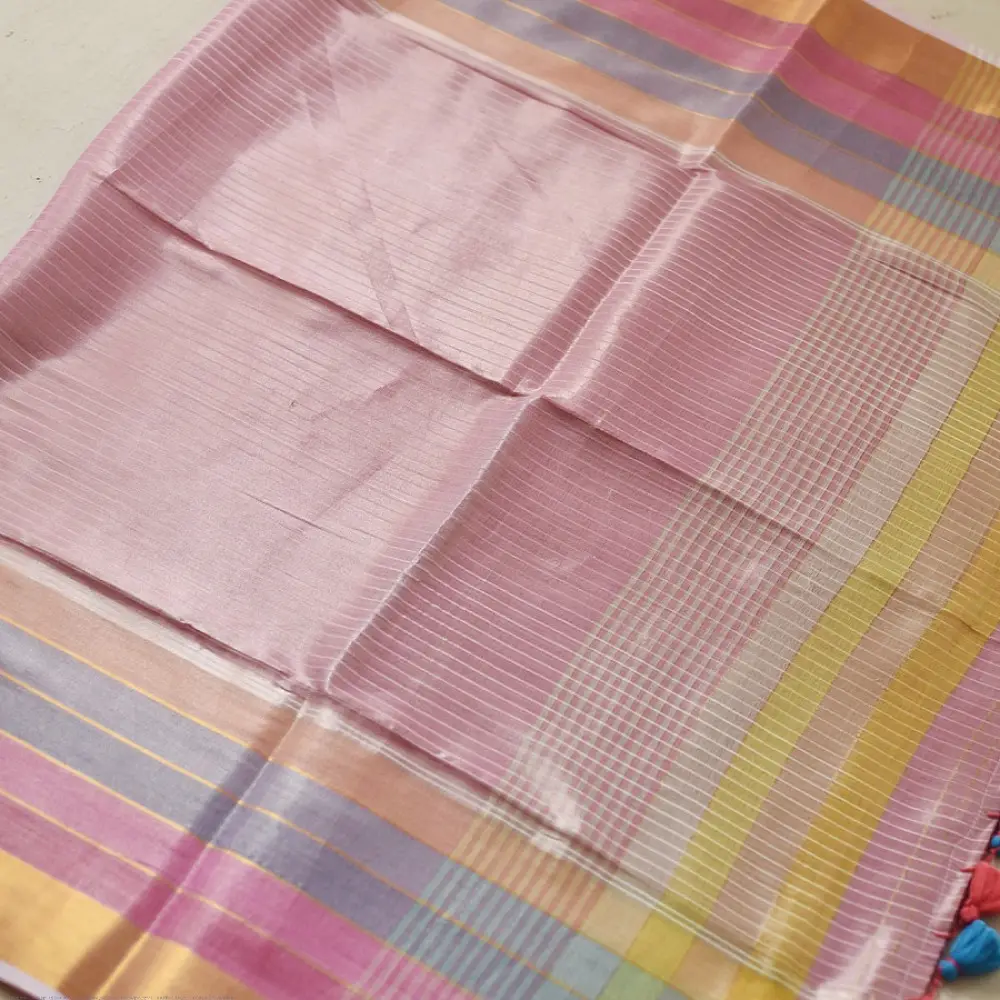 handloom pure cotton saree in soft baby pink featuring subtle fine stripes contrast woven zari border and handcrafted turquoise blue tassels on pallu