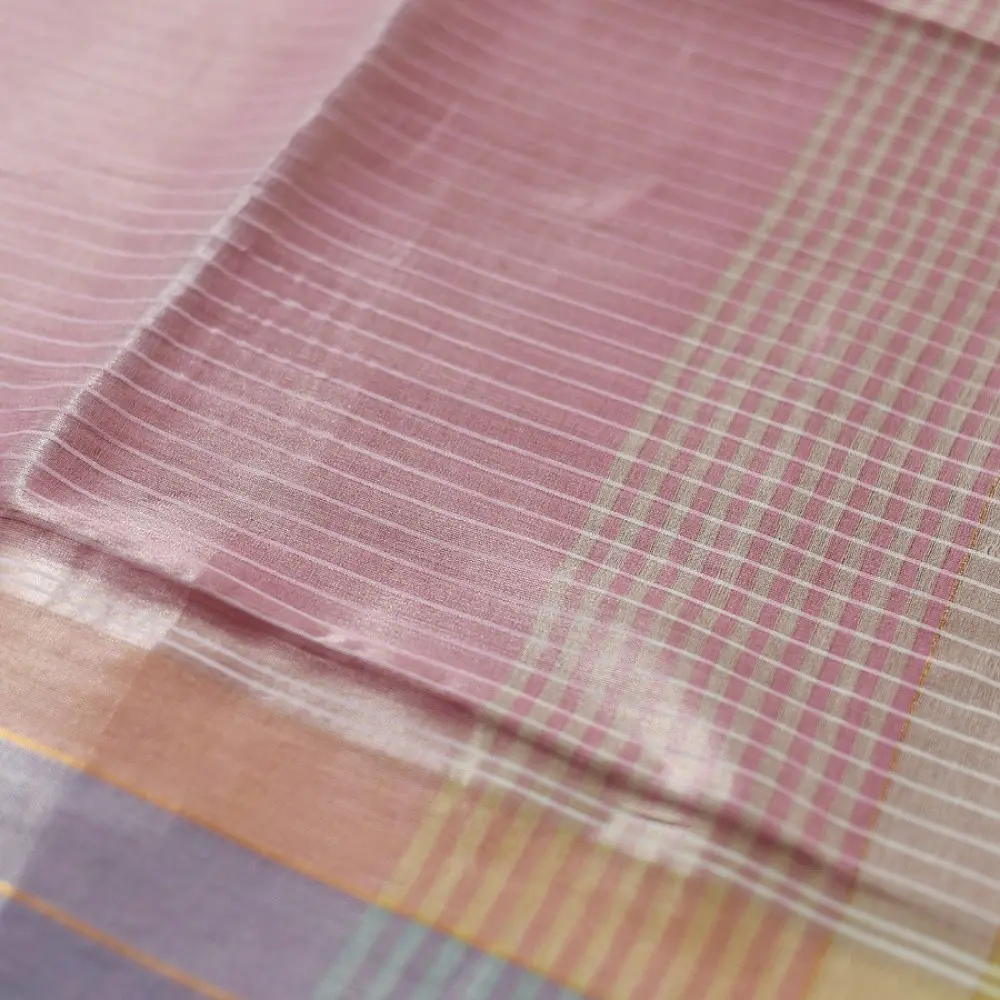 handloom pure cotton saree in soft baby pink featuring subtle fine stripes contrast woven zari border and handcrafted turquoise blue tassels on pallu