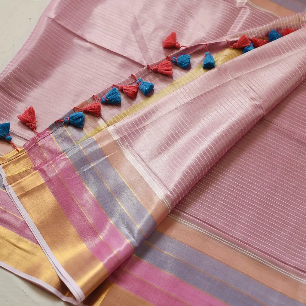handloom pure cotton saree in soft baby pink featuring subtle fine stripes contrast woven zari border and handcrafted turquoise blue tassels on pallu