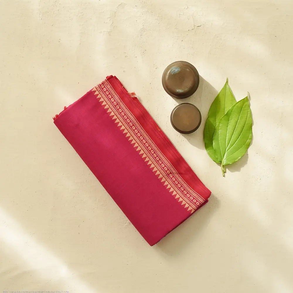 handloom begampuri pure cotton saree in deep rani pink with mustard yellow pinstripes and woven temple borders with fringe tassels