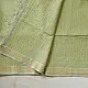 handloom pure cotton saree in subtle pista green featuring delicate fine stripes woven golden zari border and soft beige handcrafted tassels