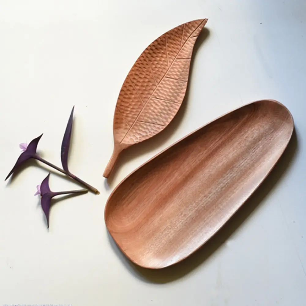 handmade wooden platter set with leaf shaped and oval carved designs