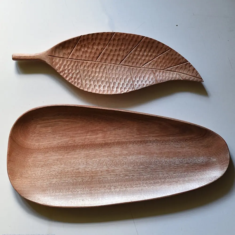 handmade wooden platter set with leaf shaped and oval carved designs