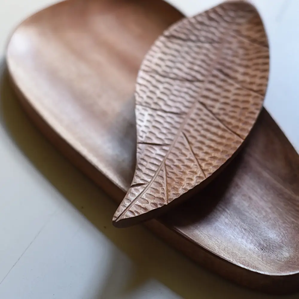 handmade wooden platter set with leaf shaped and oval carved designs