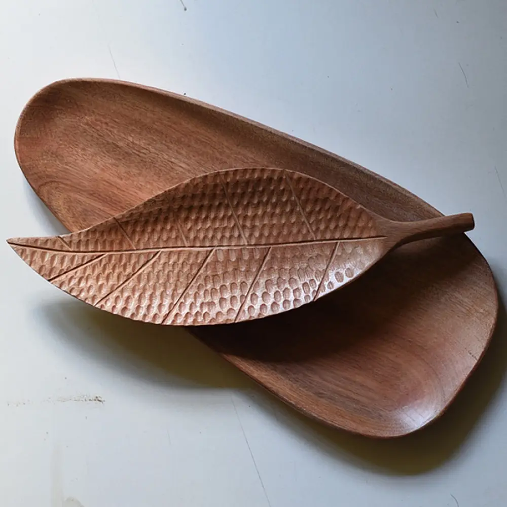 handmade wooden platter set with leaf shaped and oval carved designs