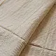 handloom pure cotton saree in luminous moti white featuring delicate micro stripes a woven gold zari border and soft handcrafted tassels