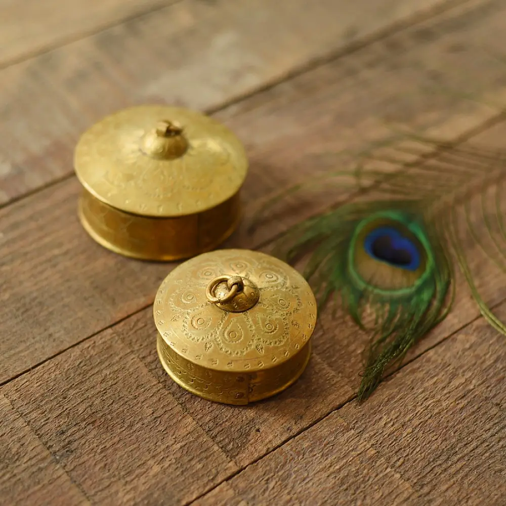 handcrafted circular brass multi-purpose boxes featuring hand-engraved floral domed lids set of two