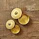 handcrafted circular brass multi-purpose boxes featuring hand-engraved floral domed lids set of two