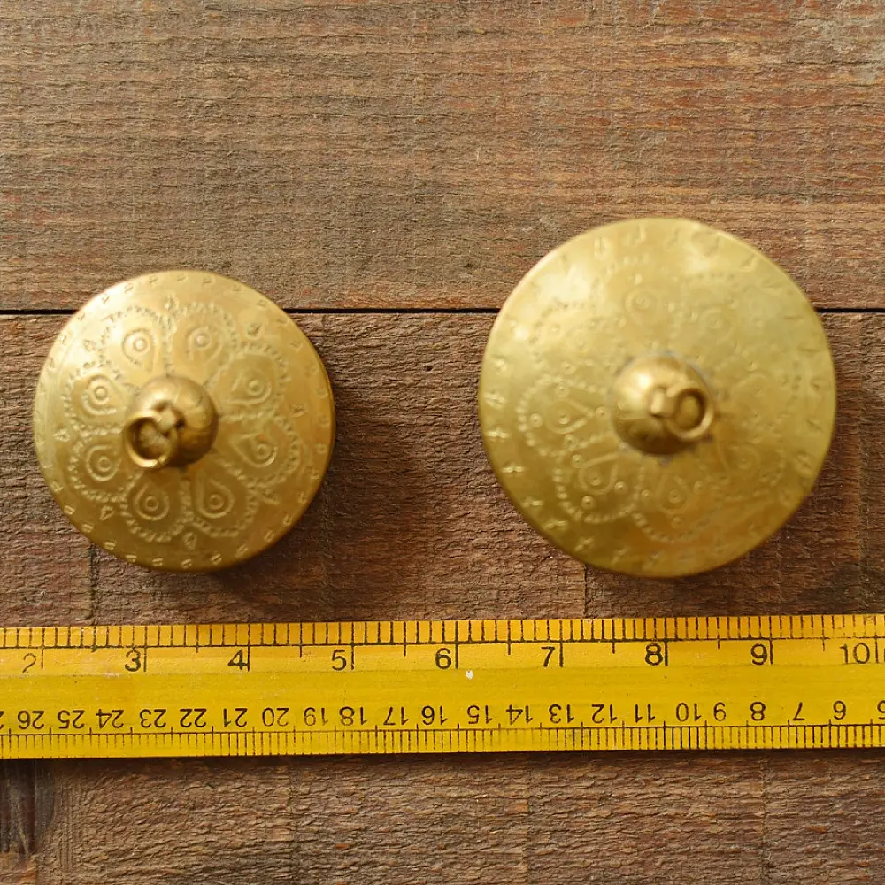 handcrafted circular brass multi-purpose boxes featuring hand-engraved floral domed lids set of two