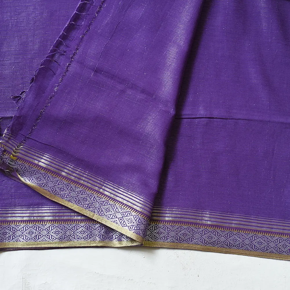 handloom pure cotton saree in deep royal purple featuring a intricate gold woven zari border and handcrafted matching purple tassels