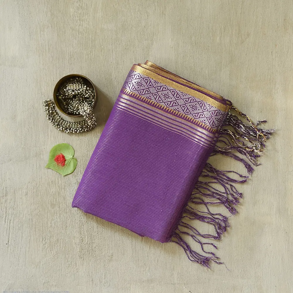 handloom pure cotton saree in deep royal purple featuring a intricate gold woven zari border and handcrafted matching purple tassels