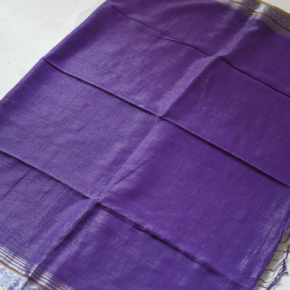 handloom pure cotton saree in deep royal purple featuring a intricate gold woven zari border and handcrafted matching purple tassels