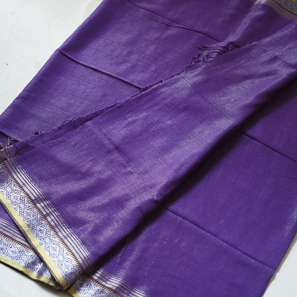 handloom pure cotton saree in deep royal purple featuring a intricate gold woven zari border and handcrafted matching purple tassels