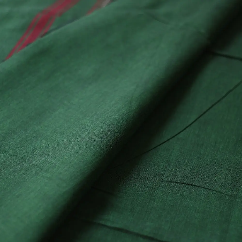 handloom begampuri pure cotton saree in forest green with red and mustard yellow woven temple borders and tassel fringe