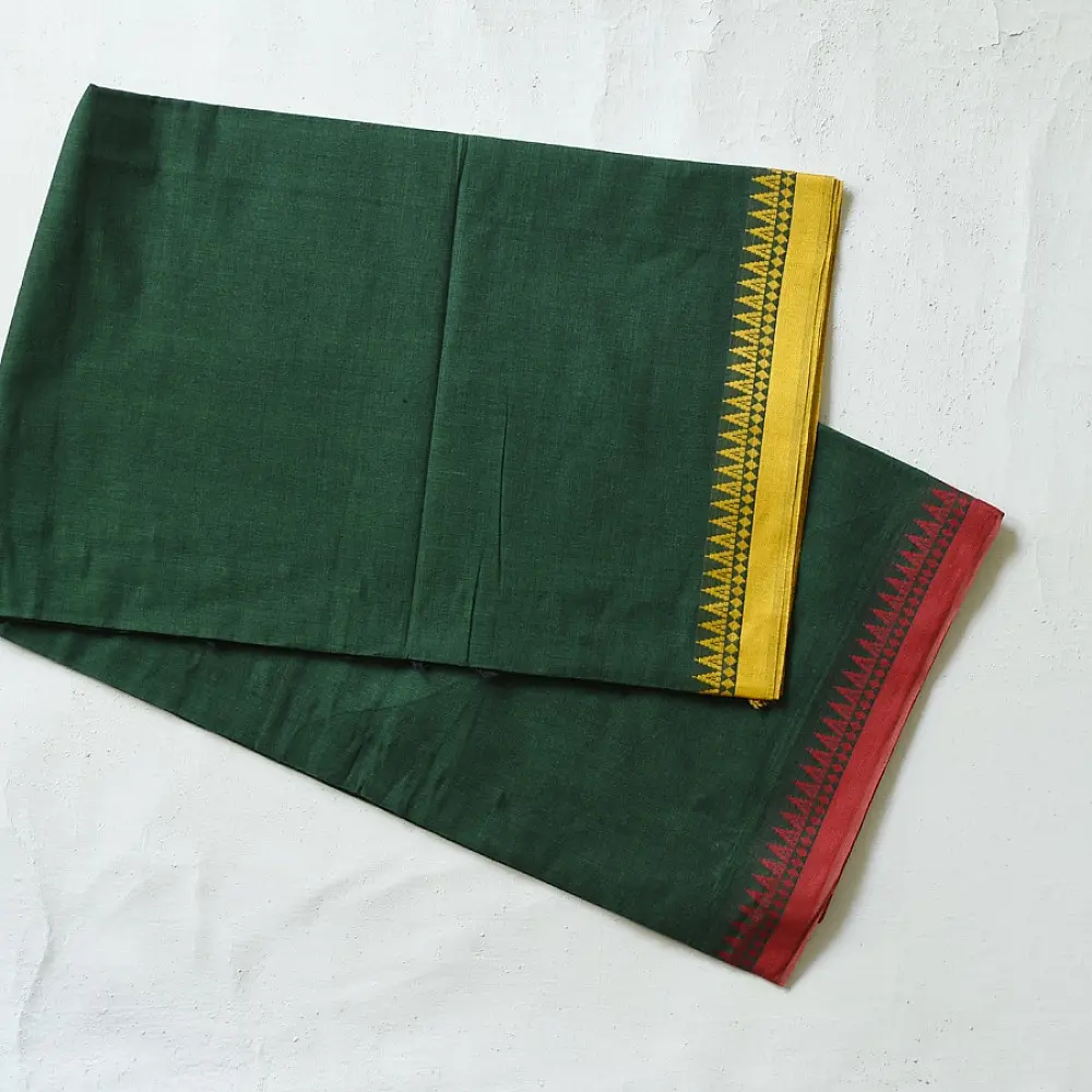 handloom begampuri pure cotton saree in forest green with red and mustard yellow woven temple borders and tassel fringe