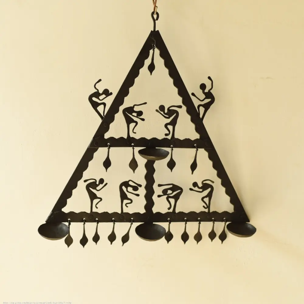 handcrafted black wrought iron triangular hanging lamp featuring multi-tier compartments with dancing tribal figures and hanging oil diya cups