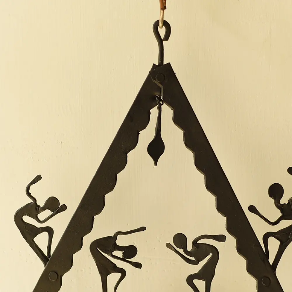 handcrafted black wrought iron triangular hanging lamp featuring multi-tier compartments with dancing tribal figures and hanging oil diya cups