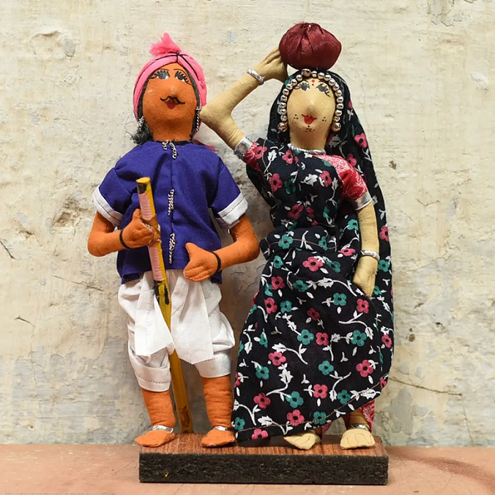 handcrafted tribal bhil fabric dolls featuring a traditional hunter or herder and a woman with a water pot