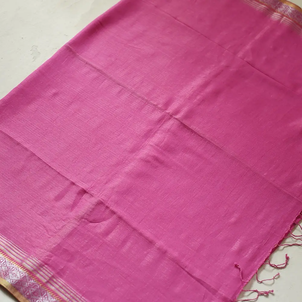 handloom pure cotton saree in soft lotus pink featuring an intricate golden zari woven patterned border and matching handcrafted tassels on pallu   