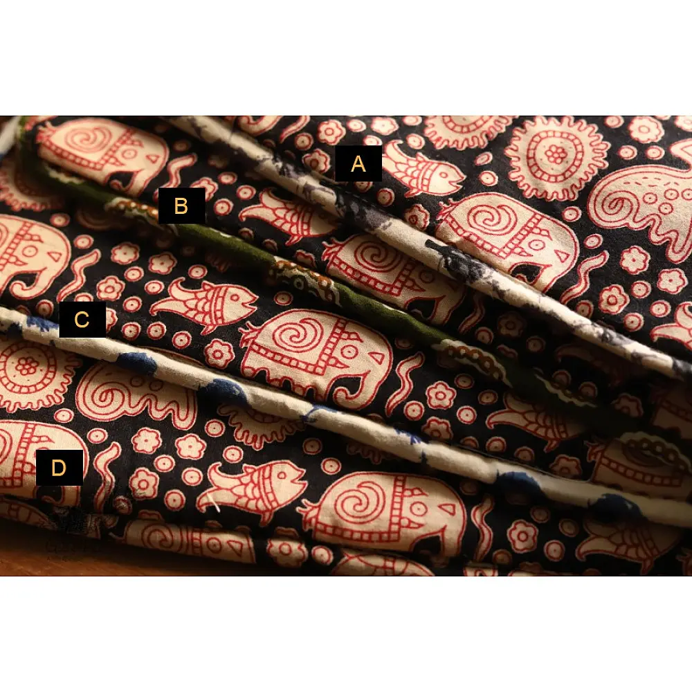 black cotton iPad cover with pink block-printed elephant and paisley motifs